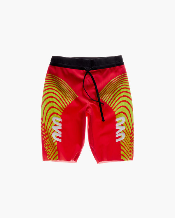 Red swim shorts with yellow wave pattern and black drawstring on a white background